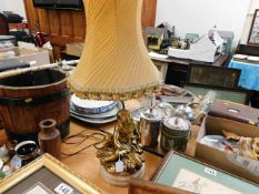 A decorative gilt lamp with silk shade