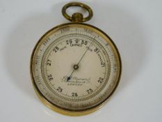A brass cased pocket barometer J. H. Steward