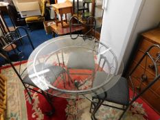 An early 21stC. glass topped table & chairs
