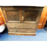 A low level rustic oak cabinet with cupboard & dra