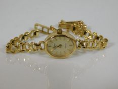A small ladies 9ct gold watch
