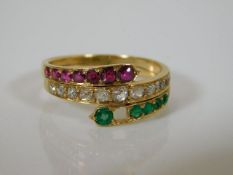 A yellow metal ring set with diamonds, rubies & gr