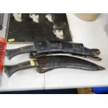 A leather cased early 20thC. kukri knife & one lat