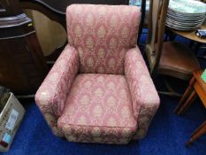 An upholstered low level antique chair
