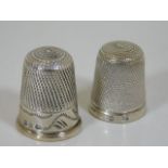 Two silver thimbles