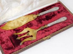 A cased French silver gilt fish serving set