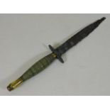 A Fairbairn Sykes brass handled commando dagger, b