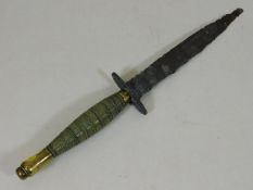 A Fairbairn Sykes brass handled commando dagger, b