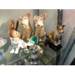 A Beswick cat, a pair of Sylvac Scottie dogs, a Sy