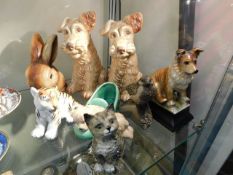 A Beswick cat, a pair of Sylvac Scottie dogs, a Sy