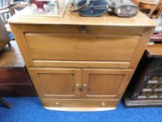 An Ercol Elm golden dawn colour cabinet with cupbo
