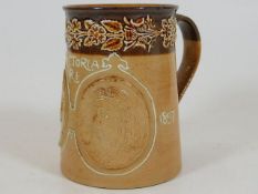 A Royal Doulton stoneware commemorative mug