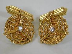 A set of high carat cufflinks set with diamond of