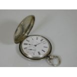 An antique silver full hunter pocket watch with duplex movement