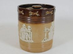 A Royal Doulton stoneware tobacco jar with lid