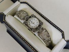A boxed ladies silver watch set with marcasite
