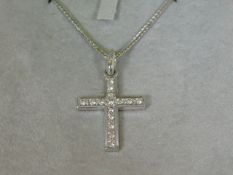An 14ct white gold chain & 18ct pendant set with diamon