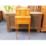 An elegant ladies writing desk with tapered legs