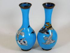 A pair of Japanese cloisonne vases depicting birds