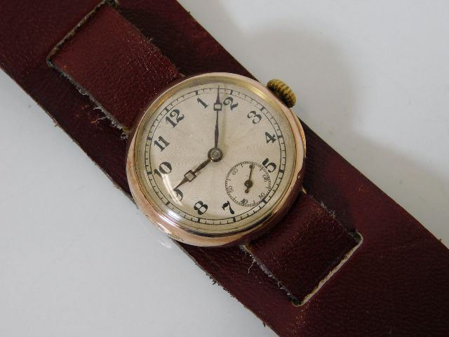 A 1922 9ct gold Rolex sunburst guilloche double hi