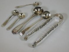 A set of Georgian silver sugar tongs twinned with