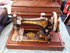 A late 19thC. cased Singer sewing machine