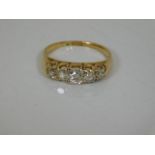 An 18ct gold ring set with five diamonds