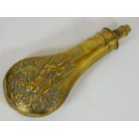 A 19thC. brass powder flask with game decor