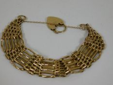 A 9ct gold seven bar gate bracelet
