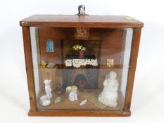 An antique mahogany cased model of period fireside