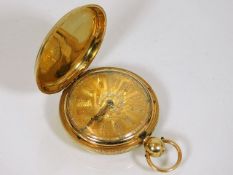 An 18ct full hunter gold pocket watch with gold co