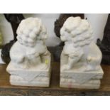 A pair of carved heavy Chinese alabaster foo lion