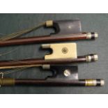 Three antique violin bows, one ivory