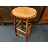 An antique elm farmhouse stool