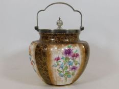 A Royal Doulton biscuit barrel with floral & gilde