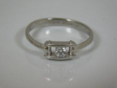 A contemporary platinum diamond solitaire ring