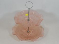 An art deco period pink glass cake stand
