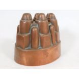 A Victorian copper jelly mould with castle design