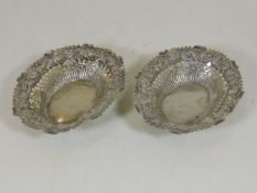 A pair of silver bon bon dishes