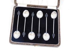A cased set of silver coffee bean spoons