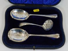 A cased silver sugar sifter & two dessert serving
