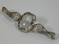 An antique silver & moonstone brooch
