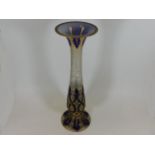 A 19thC. tall Bohemian glass vase with small crude