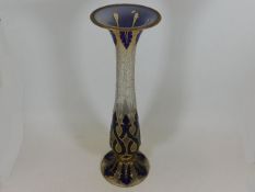 A 19thC. tall Bohemian glass vase with small crude