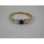 A yellow metal diamond & sapphire ring