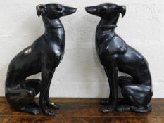 A pair of bronze life size fireside whippet dogs