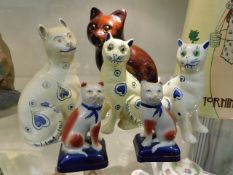 Three Galle style cats, a pair of 20thC. Staffords