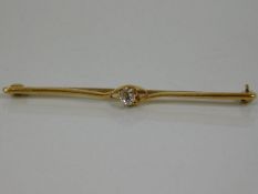 An 18ct gold brooch set with diamond