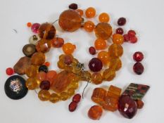 A quantity of mixed beads including Victorian ambe
