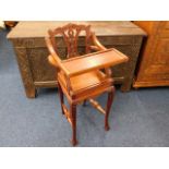 An early 20thC. carved childs high chair